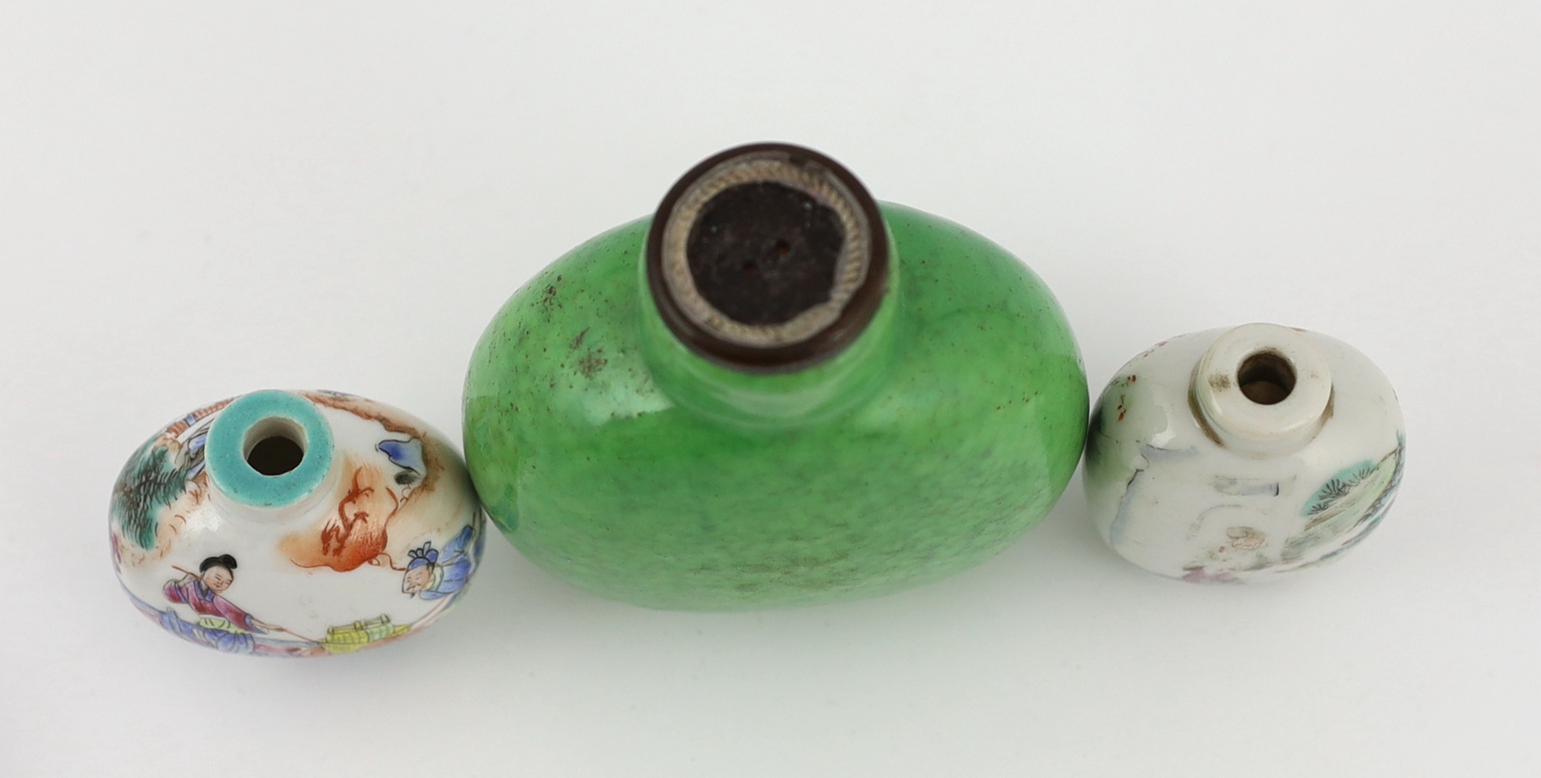 A large Chinese green crackle glazed snuff bottle, Daoguang mark and period, and three other 19th century porcelain snuff bottles